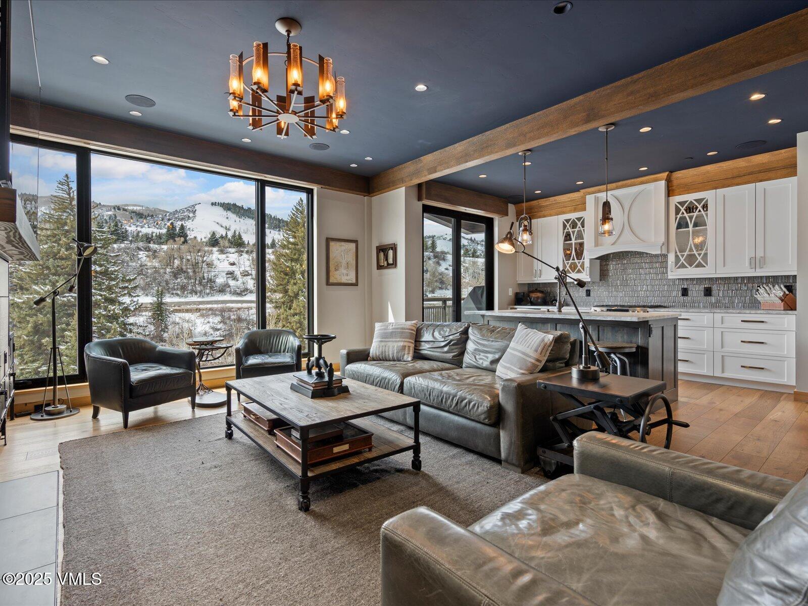 1 Waterfront Way, Unit 204 Avon, CO 81620 - Photo 1 of 38 a living room with furniture and a large window