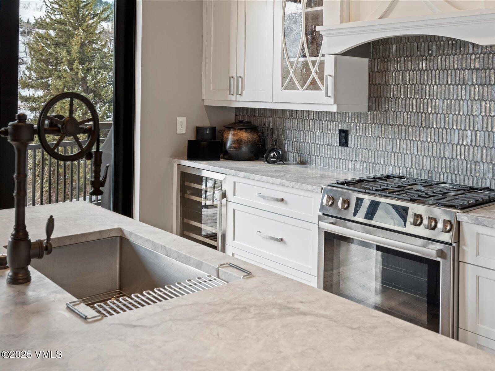 1 Waterfront Way, Unit 204 Avon, CO 81620 - Photo 13 of 38 a kitchen with granite countertop a stove and a sink