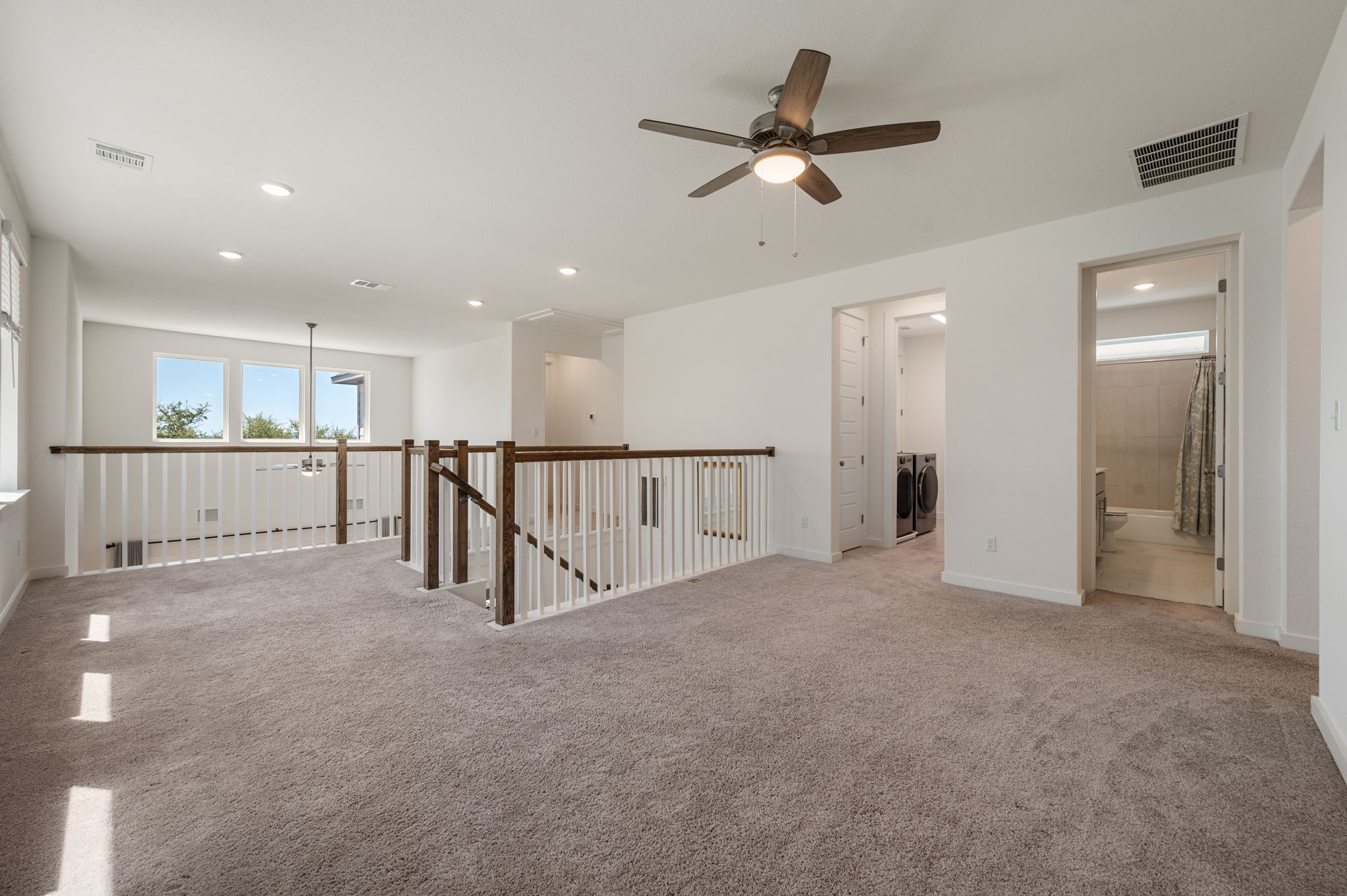256 Comfort Maple Lane Dripping Springs, TX 78620 - Photo 17 of 39 A spacious bonus room offers a generous secondary living space.