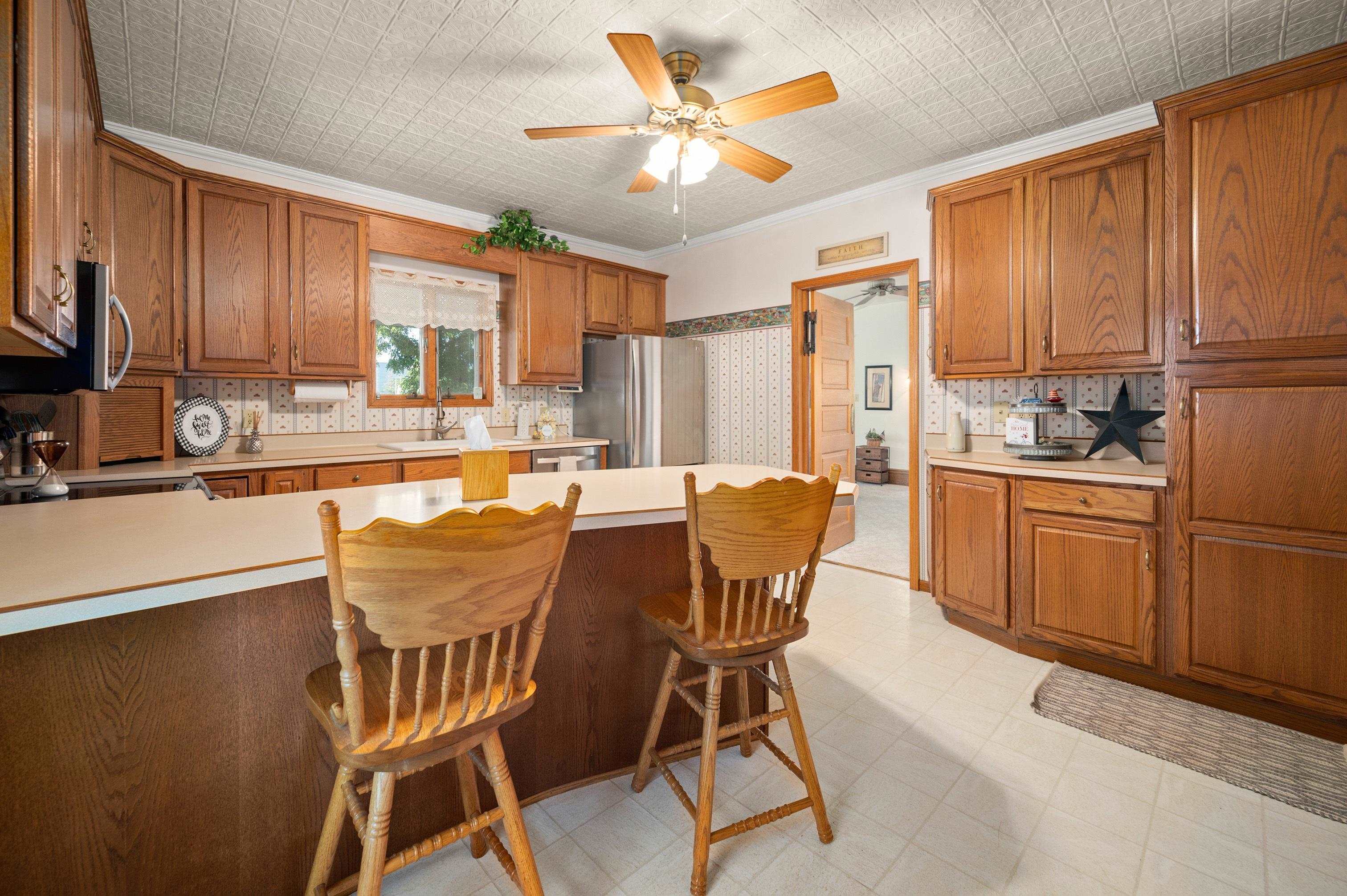 1311 Steward Road Steward, IL 60553 - Photo 23 of 62 a dining room with furniture a window and kitchen view