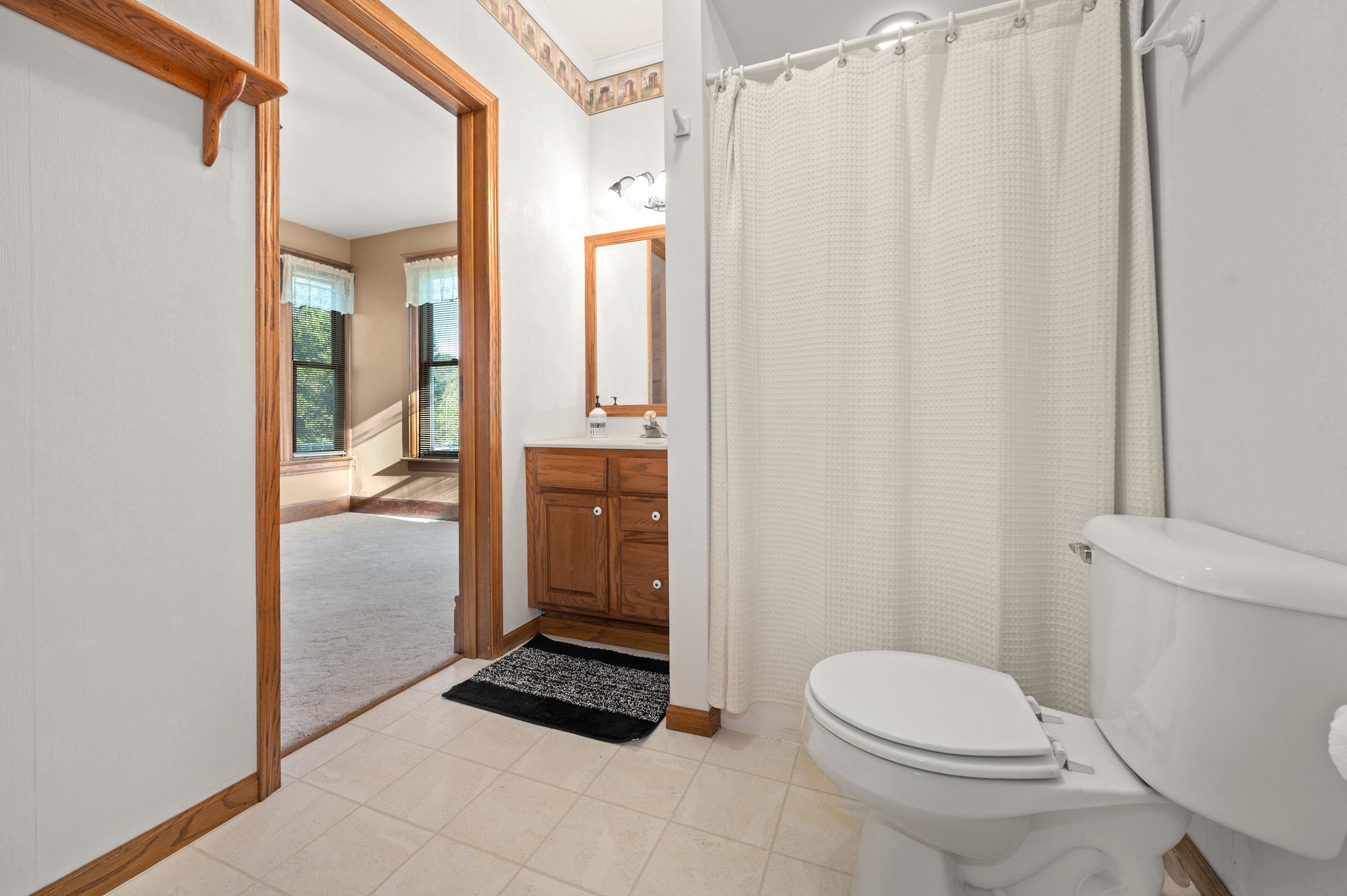 1311 Steward Road Steward, IL 60553 - Photo 26 of 62 a bathroom with a toilet a sink and shower