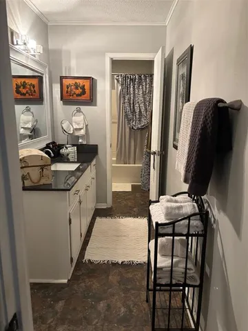 a kitchen with stainless steel appliances granite countertop a refrigerator and a stove