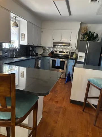 a kitchen with sink cabinets and window