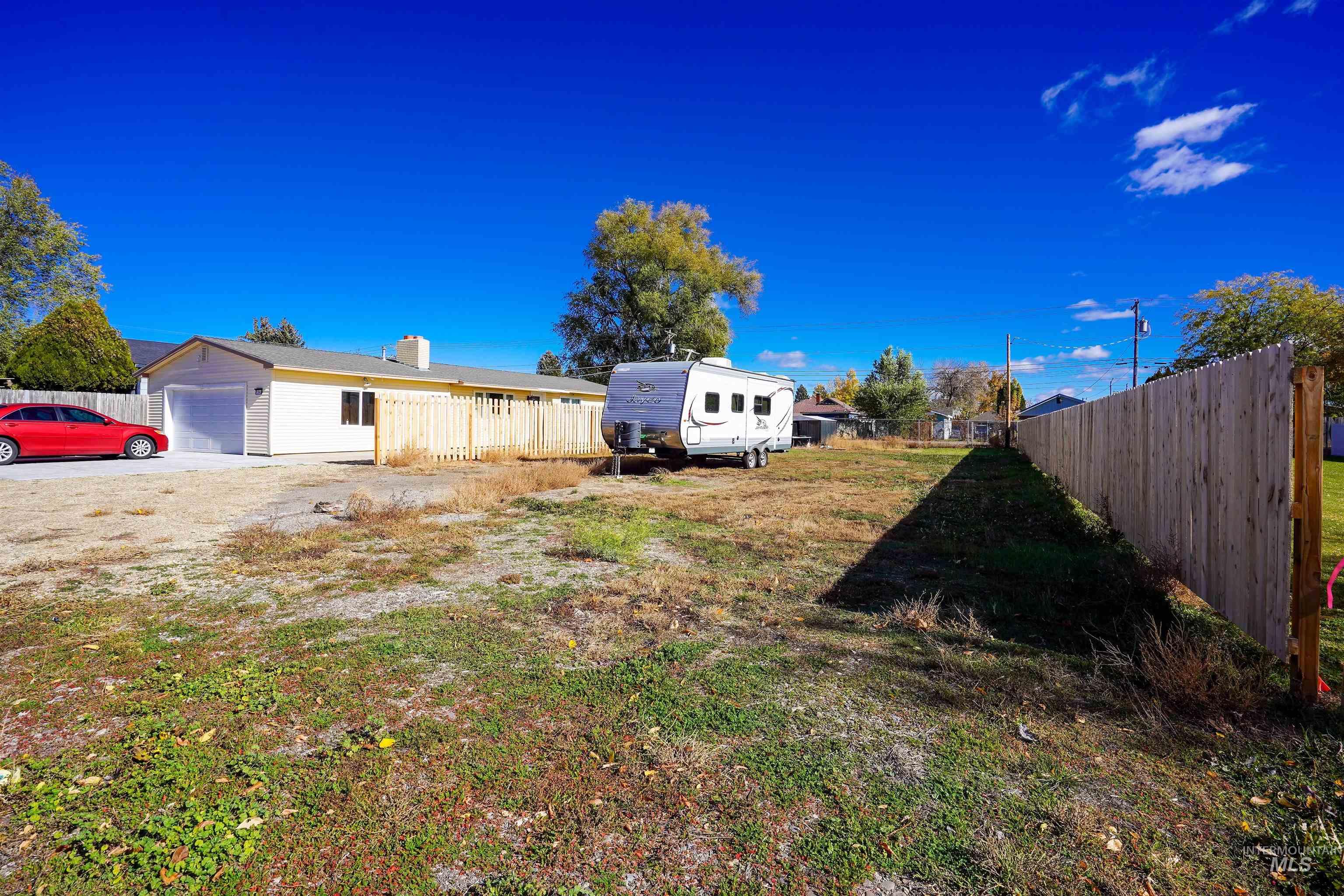 View of yard with a garage