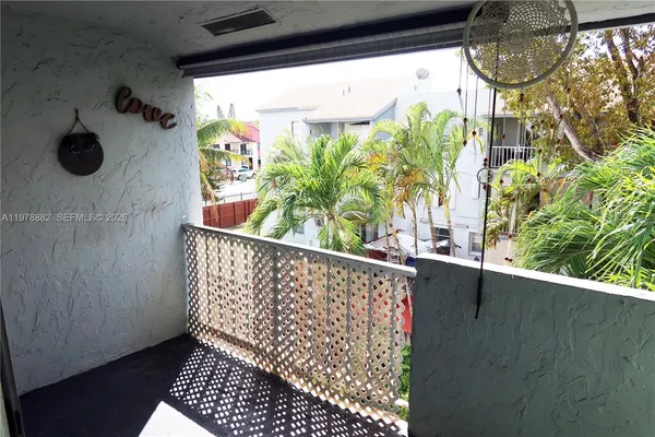 a balcony with trees in front of it