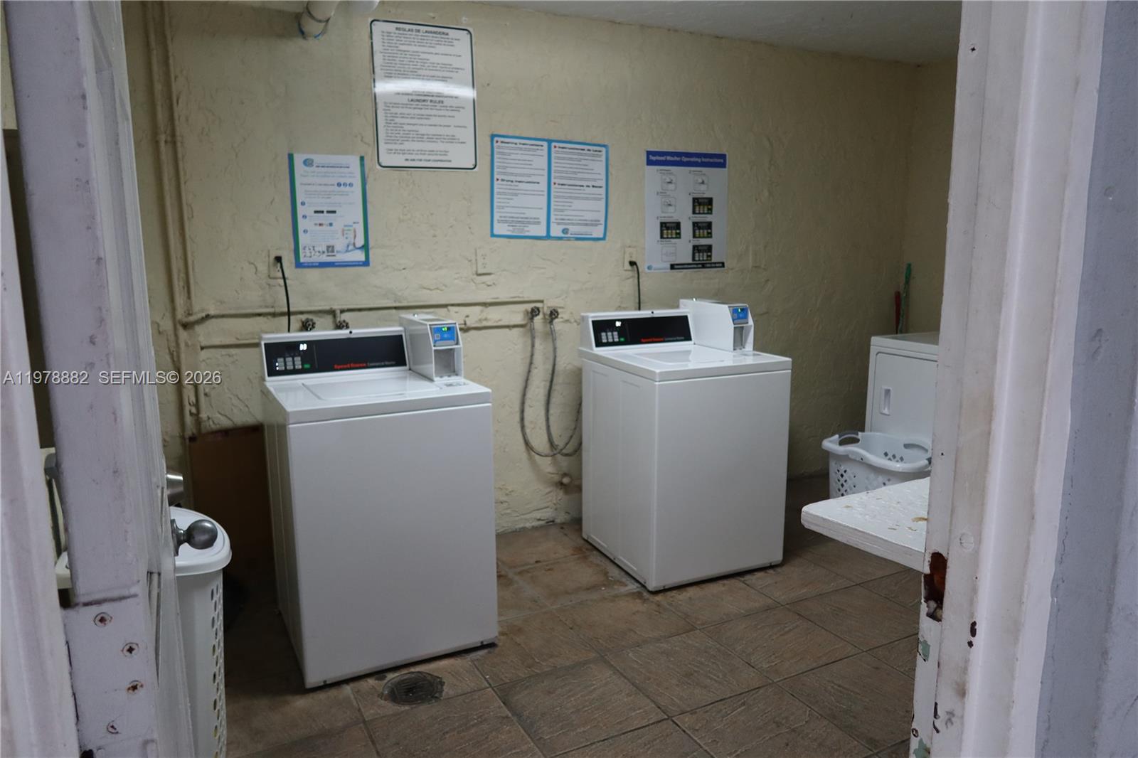 1725 West 60th Street, Unit F330 Hialeah, FL 33012 - Photo 15 of 16 a utility room with dryer and washer