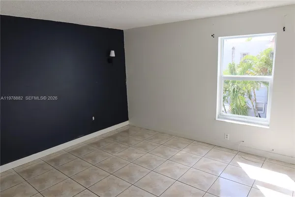 a view of an empty room with a window