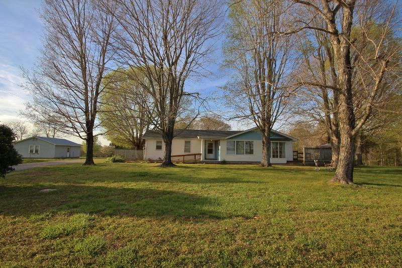 7251 Anderson Road Fairview, TN 37062 - Photo 2 of 30 This cute farmhouse sits on 6 acres with storage barns and a lake.