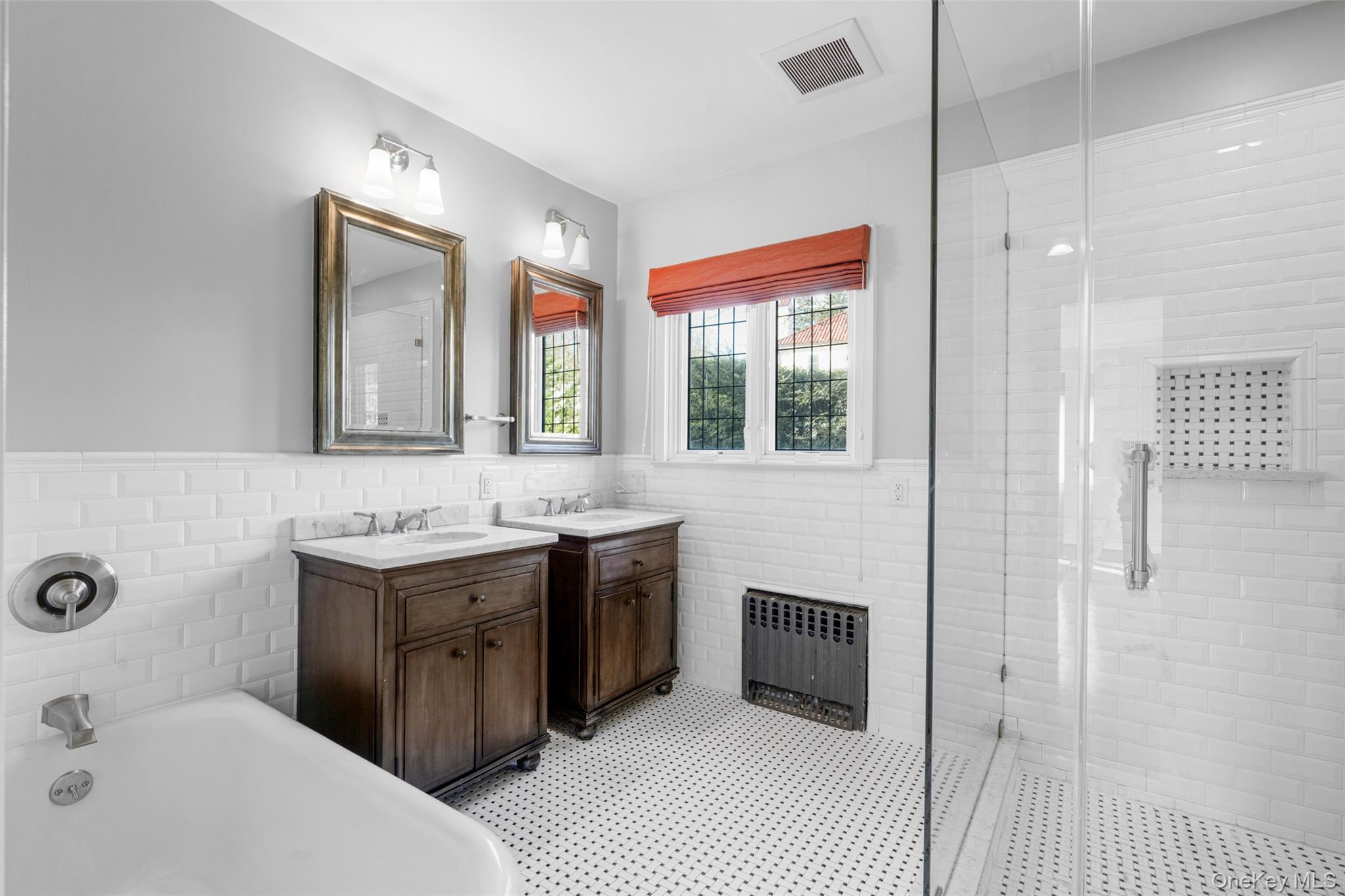 22 Verdun Avenue New Rochelle, NY 10804 - Photo 16 of 31 a spacious bathroom with a double vanity sink a mirror and a bathtub