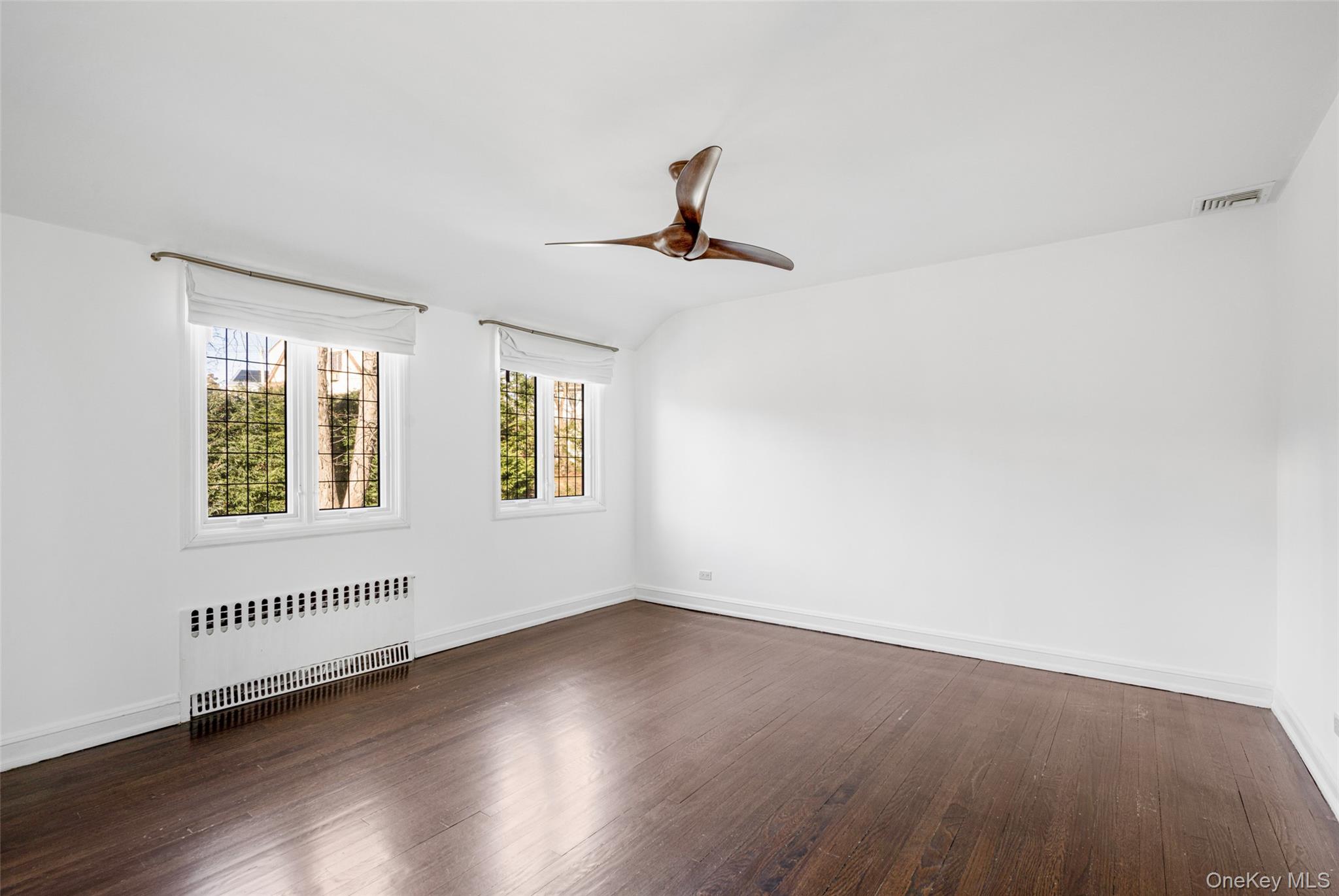 22 Verdun Avenue New Rochelle, NY 10804 - Photo 19 of 31 a view of a livingroom with wooden floor and a window