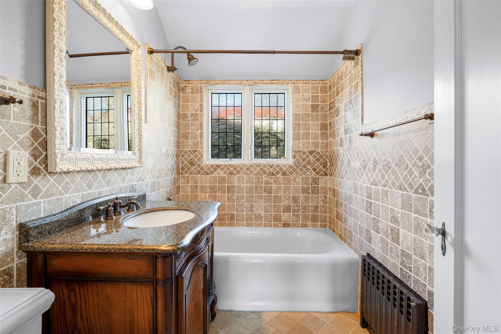 22 Verdun Avenue New Rochelle, NY 10804 - Photo 20 of 31 a bathroom with a sink and a bathtub