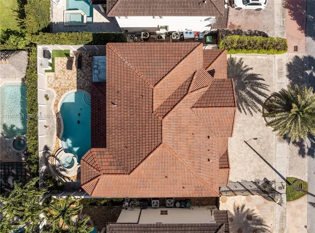 a aerial view of a house with a yard patio and outdoor seating