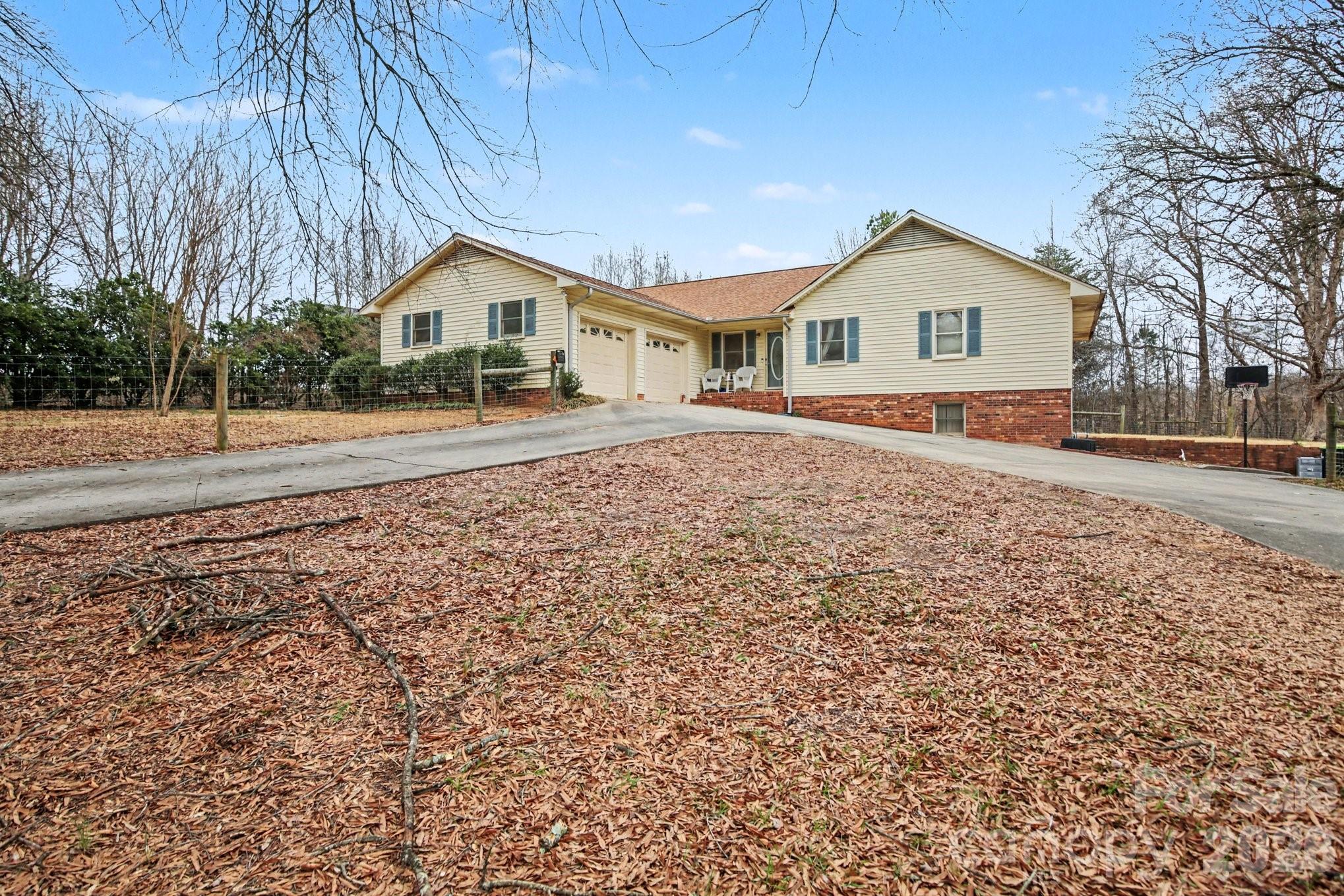 a front view of house with wooden fence