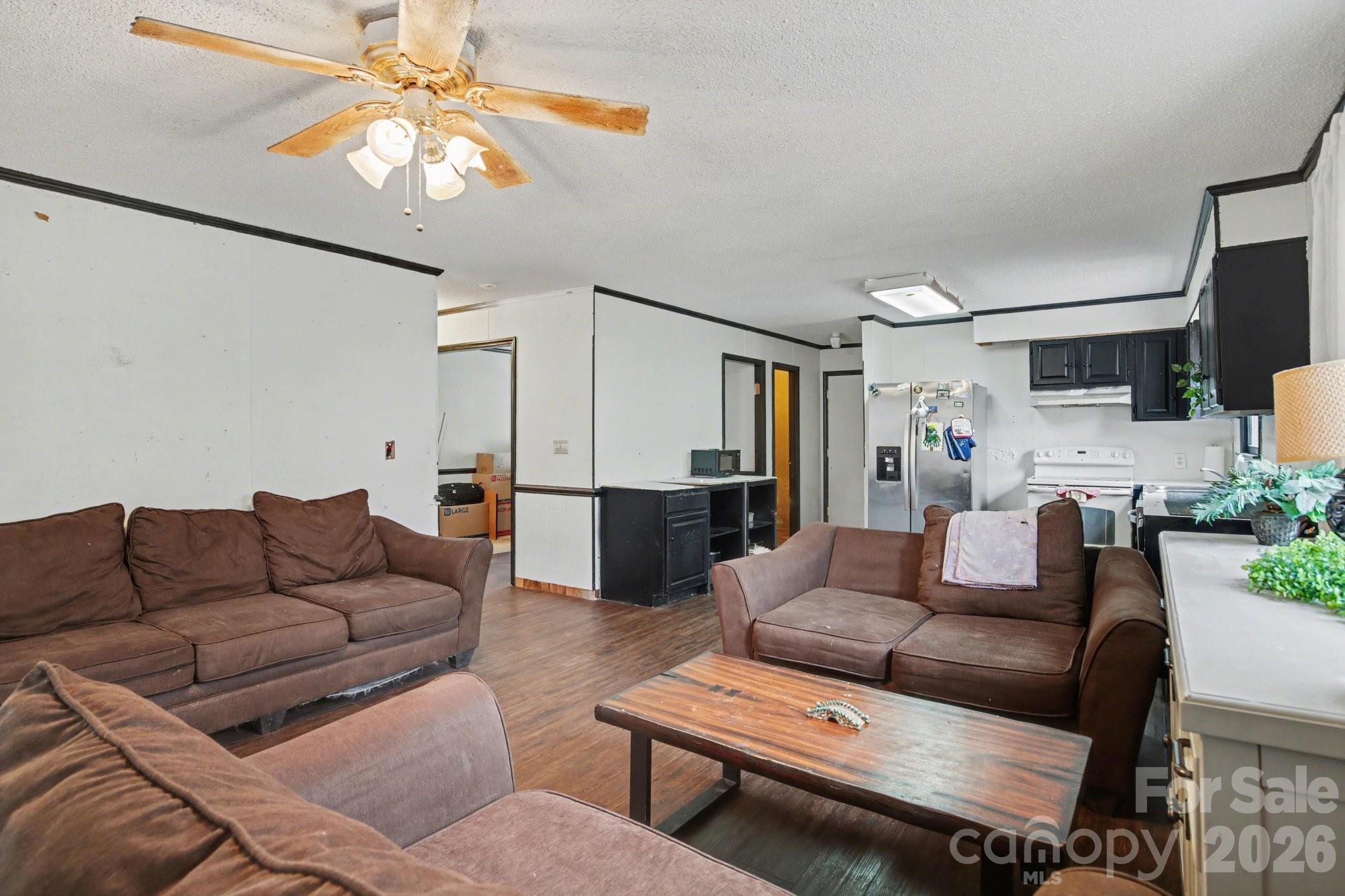 236 Tussey Road Lexington, NC 27295 - Photo 3 of 11 a living room with furniture and a chandelier