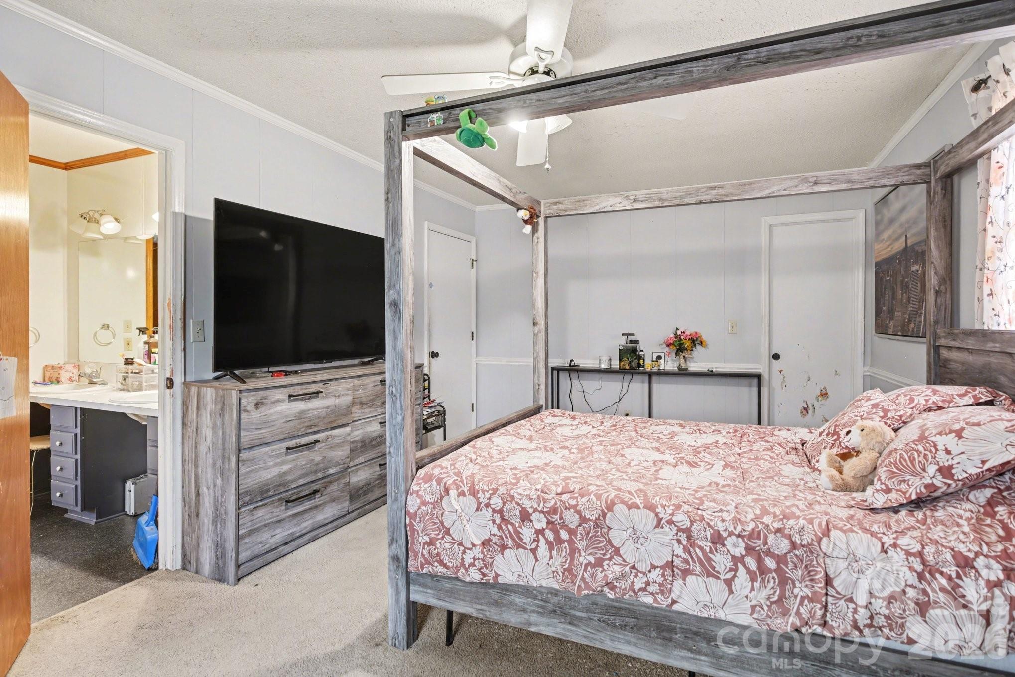 236 Tussey Road Lexington, NC 27295 - Photo 6 of 11 a bedroom with a bed and a flat screen tv