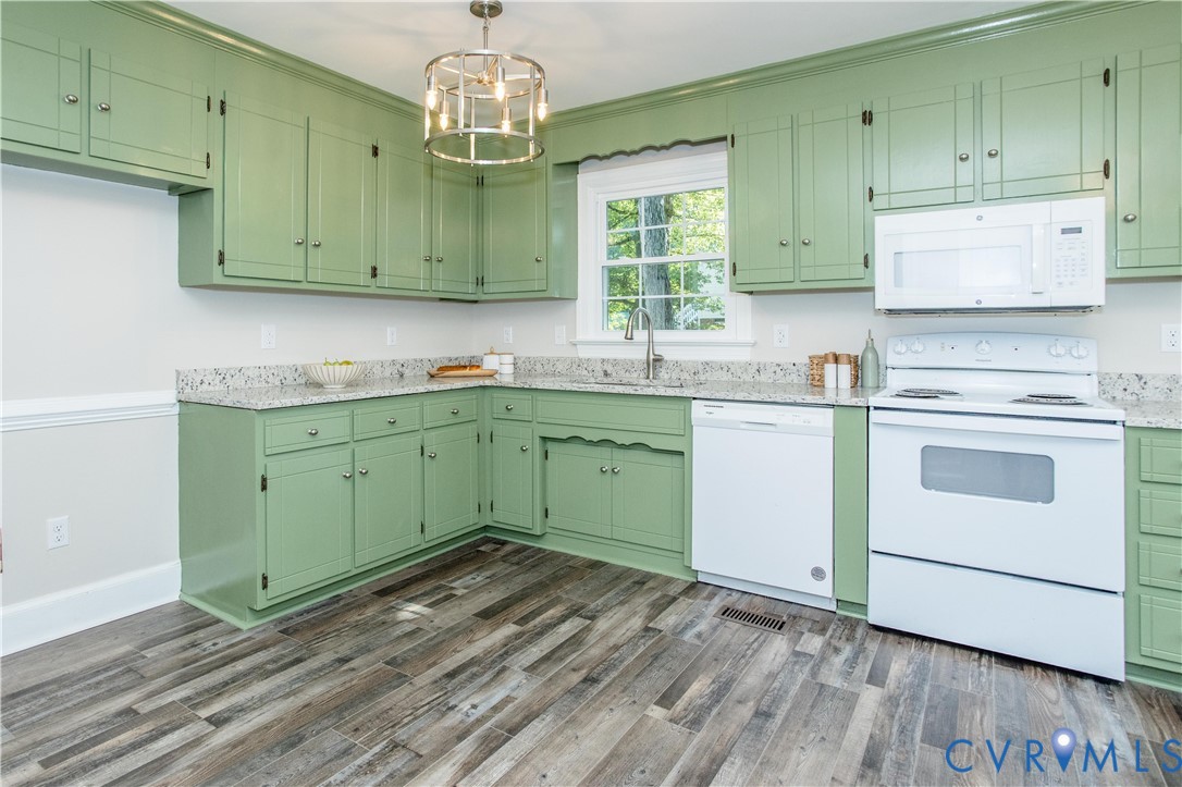 13110 Hensley Road Midlothian, VA 23112 - Photo 7 of 24 a kitchen with a sink cabinets and window