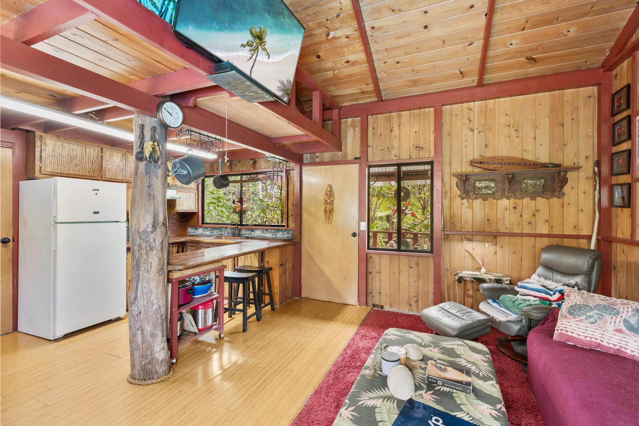 11-2897 Makoa Road Mountain View, HI 96771 - Photo 3 of 30 a bed room with a bed and a large window