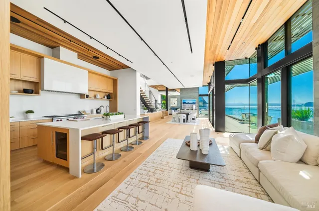 a terrace with outdoor seating and city view