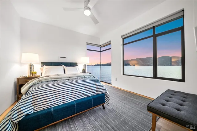 a view of a swimming pool and outdoor seating