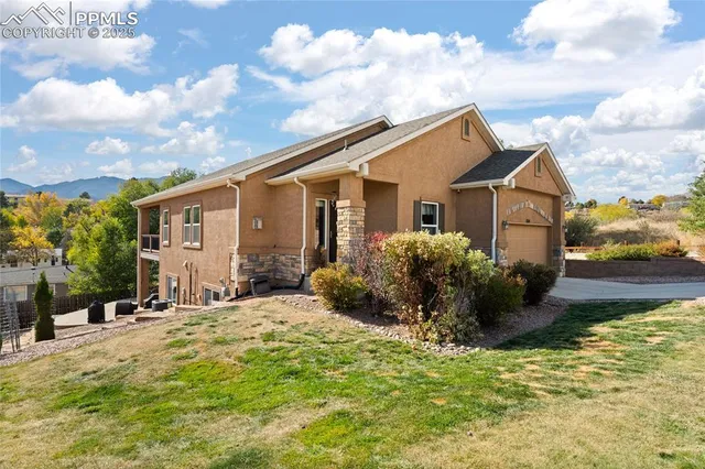 a view of a house with backyard porch and sitting area
