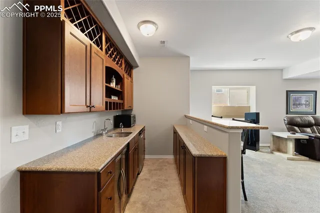 a kitchen that has a sink and a stove in it