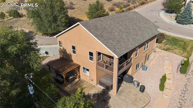 an aerial view of a house with a yard