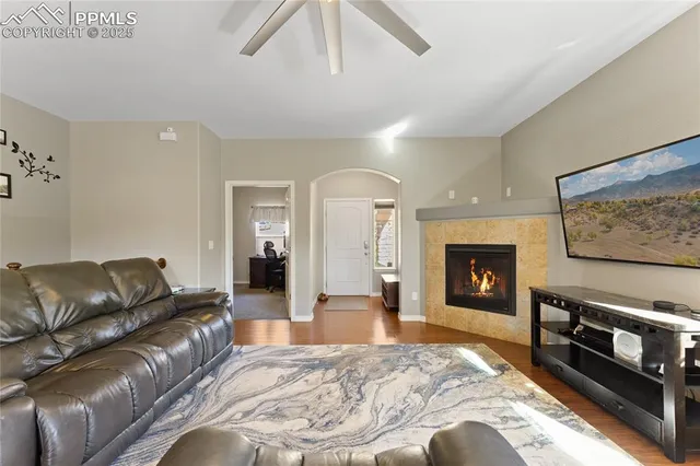 a living room with furniture fireplace and flat screen tv