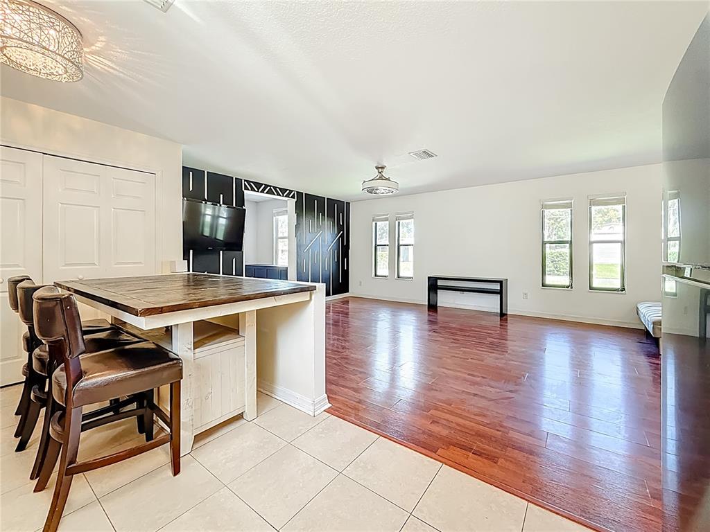 2372 18th Avenue Southwest Largo, FL 33774 - Photo 12 of 80 a view of a livingroom with furniture and wooden floor