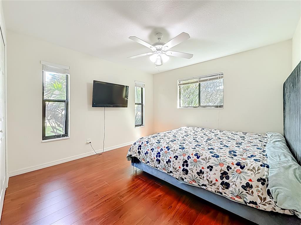 2372 18th Avenue Southwest Largo, FL 33774 - Photo 19 of 80 a bedroom with bed window and flat screen tv