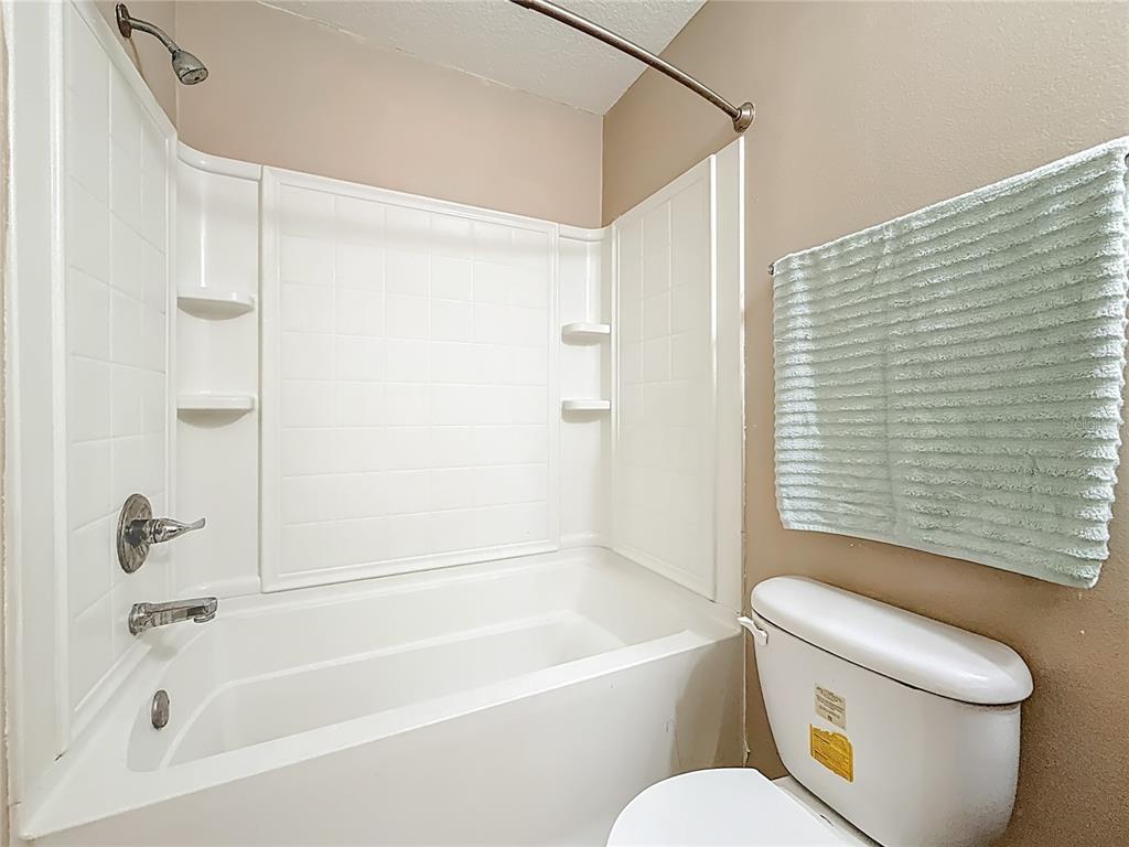 2372 18th Avenue Southwest Largo, FL 33774 - Photo 23 of 80 a bathroom with a toilet and a bathtub