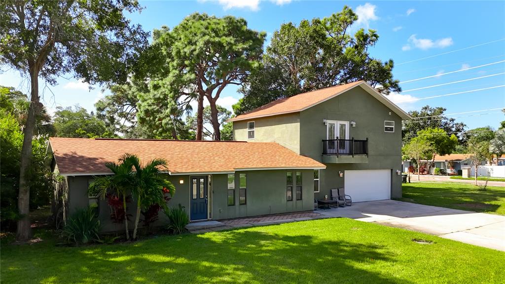 2372 18th Avenue Southwest Largo, FL 33774 - Photo 3 of 80 a view of house with a yard