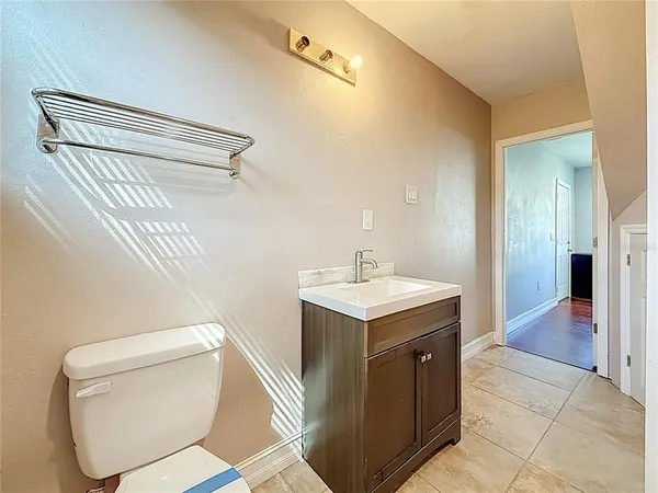 a spacious bedroom with a bed and a walk in closet