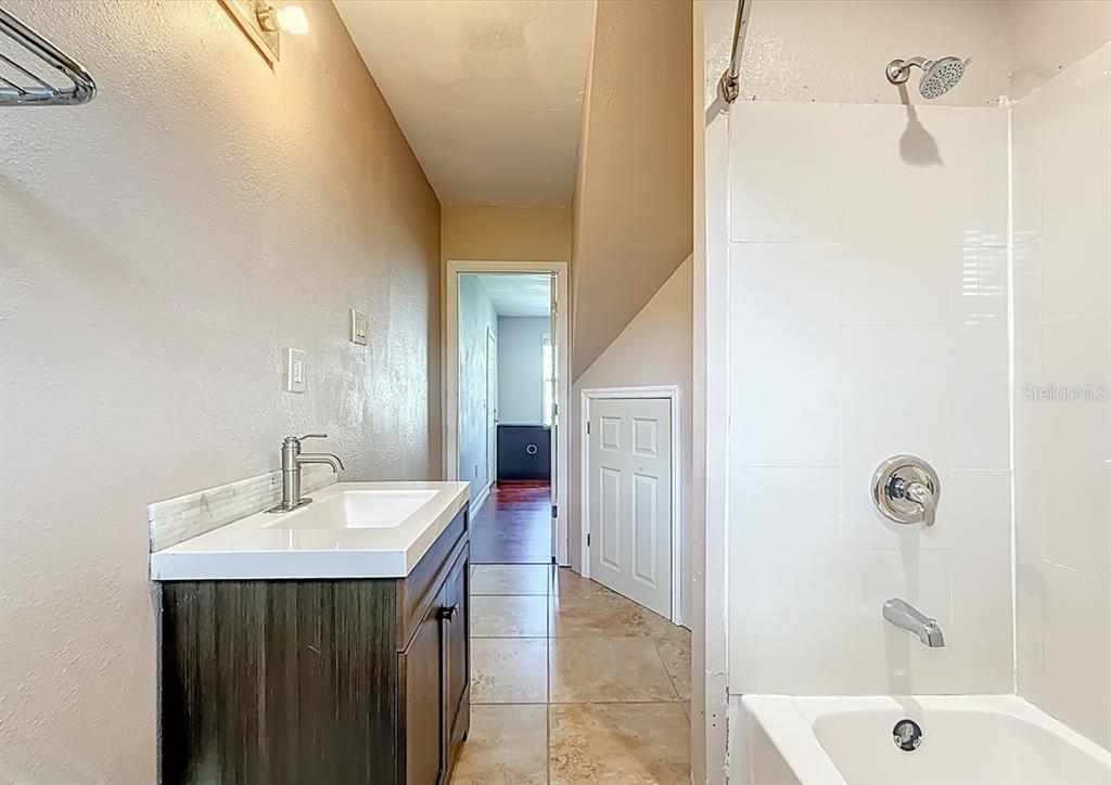 2372 18th Avenue Southwest Largo, FL 33774 - Photo 33 of 80 a bathroom with a sink and a mirror