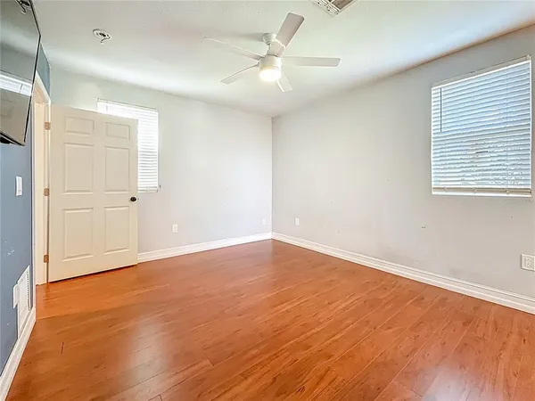 a view of a livingroom with closet and a window