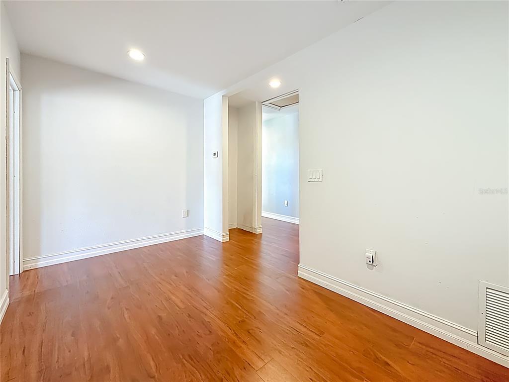 2372 18th Avenue Southwest Largo, FL 33774 - Photo 42 of 80 a view of an empty room with wooden floor