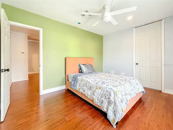 a front view of a house with a garden and yard