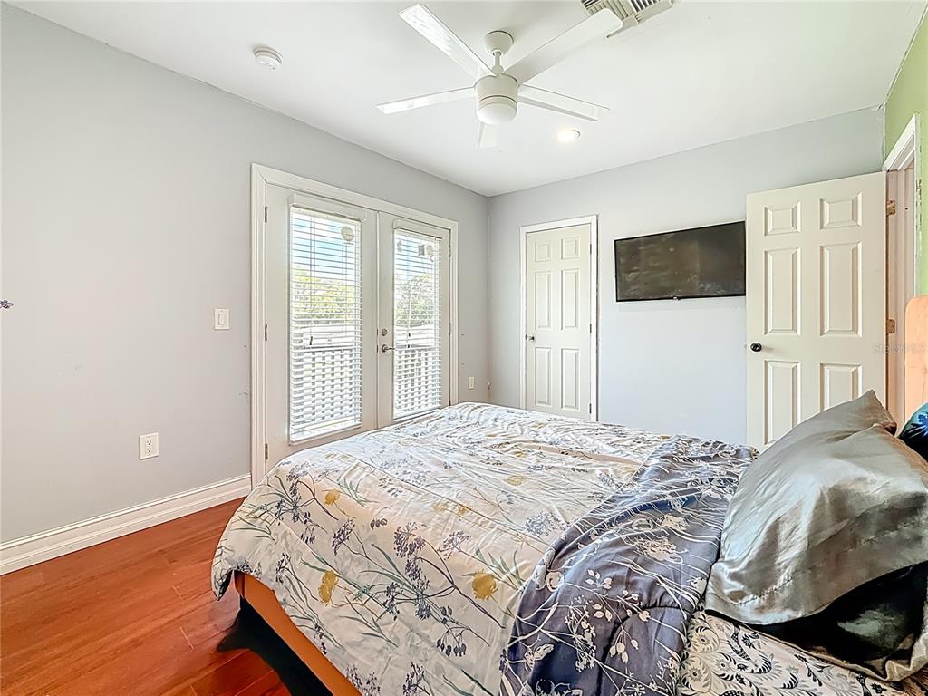 2372 18th Avenue Southwest Largo, FL 33774 - Photo 50 of 80 a bedroom with a bed and a flat screen tv