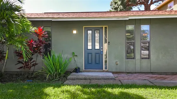 a view of a kitchen with wooden floor and a kitchen