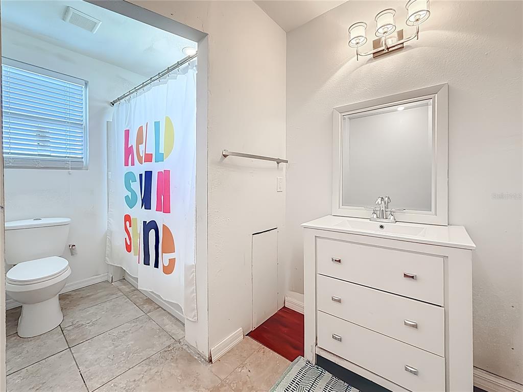 2372 18th Avenue Southwest Largo, FL 33774 - Photo 55 of 80 a spacious bathroom with a sink a vanity and a mirror