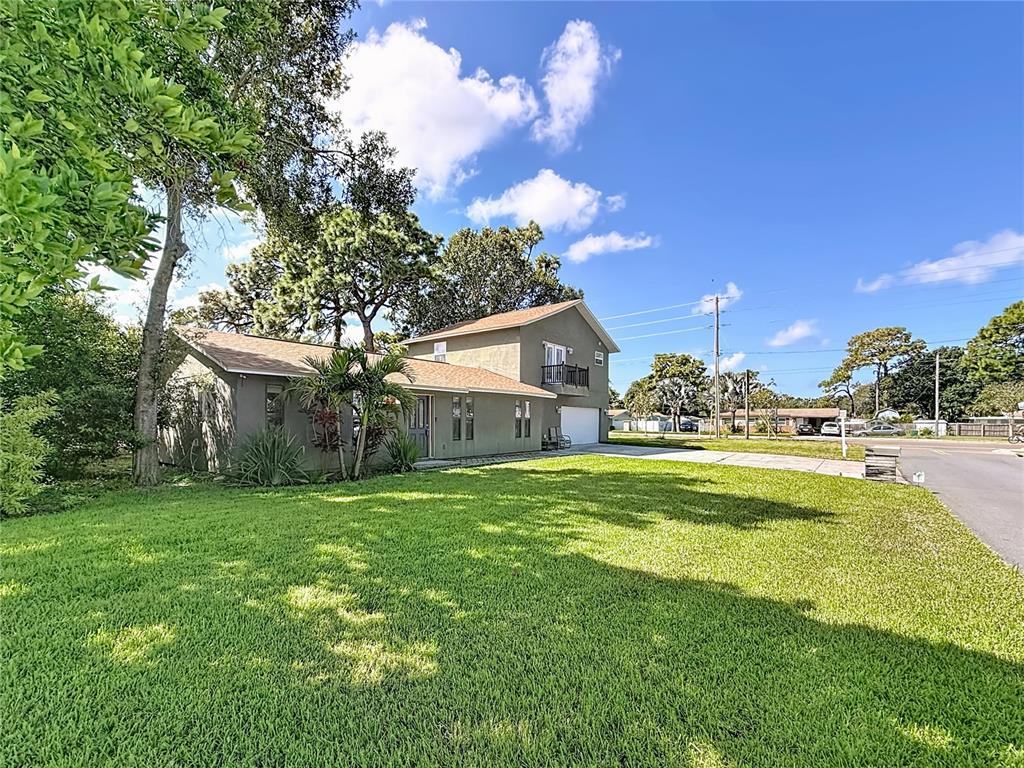 2372 18th Avenue Southwest Largo, FL 33774 - Photo 66 of 80 a front view of a house with swimming pool having outdoor seating
