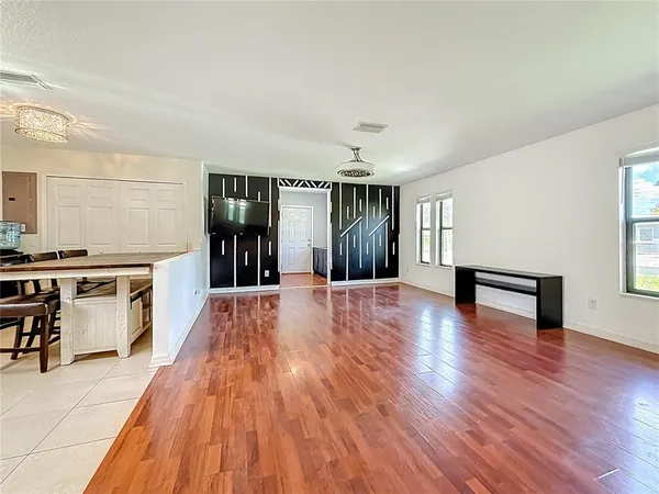 a view of a livingroom with furniture and wooden floor