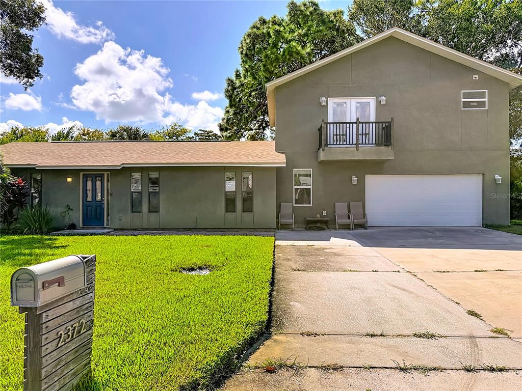 2372 18th Avenue Southwest Largo, FL 33774 - Photo 79 of 80 a front view of a house with a yard