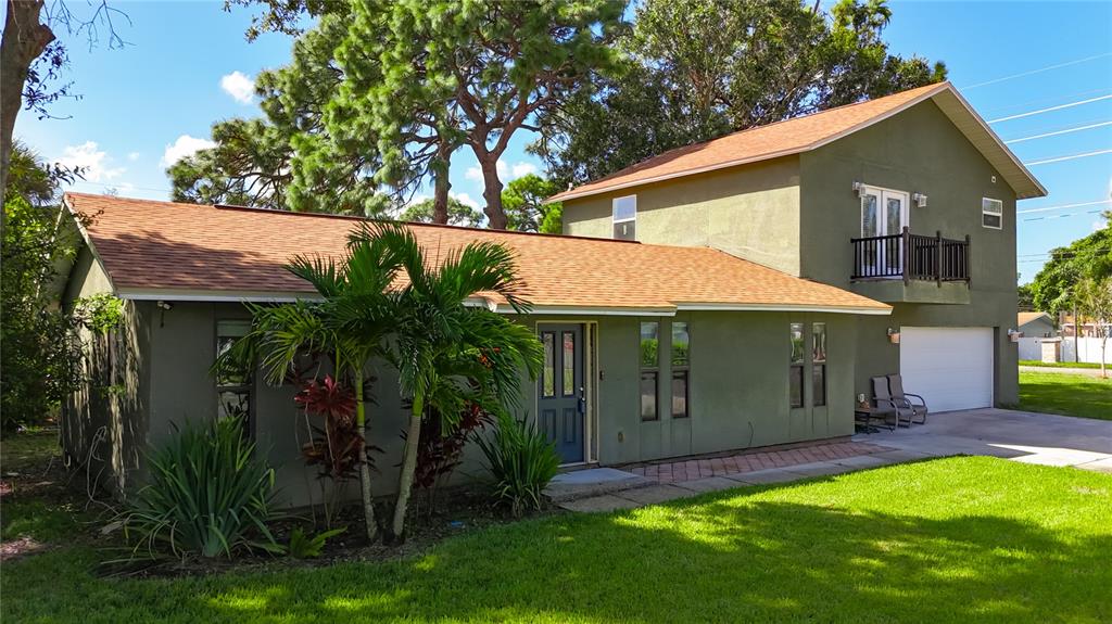2372 18th Avenue Southwest Largo, FL 33774 - Photo 80 of 80 a view of a house with a yard plants and large tree