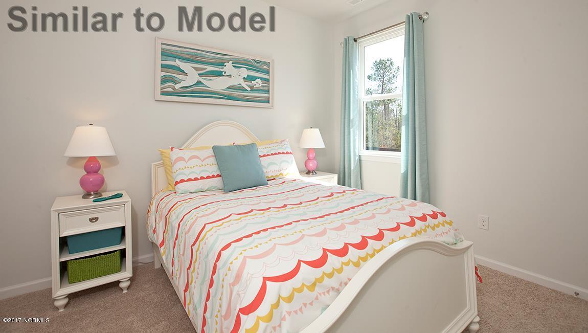 45 Rochester Street, Unit LOT 11 Hampstead, NC 28443 - Photo 26 of 39 Guest bedroom