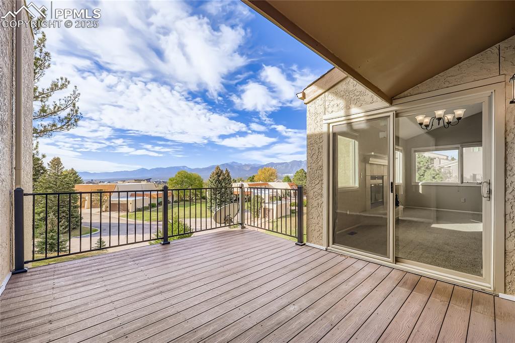 368 Mission Hill Way Colorado Springs, CO 80921 - Photo 15 of 39 a view of a balcony with wooden floor