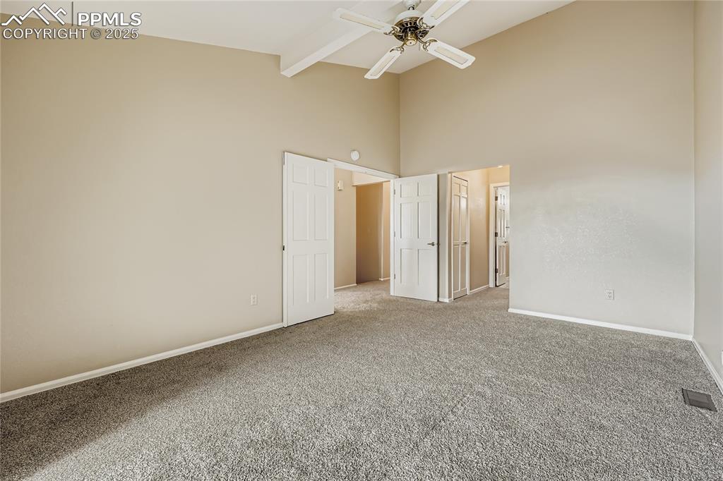 368 Mission Hill Way Colorado Springs, CO 80921 - Photo 17 of 39 an empty room with a empty space and a ceiling fan