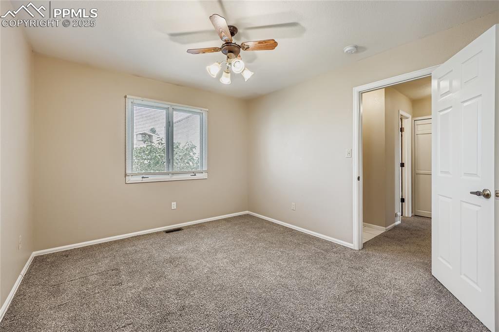 368 Mission Hill Way Colorado Springs, CO 80921 - Photo 22 of 39 a view of an empty room with a fan