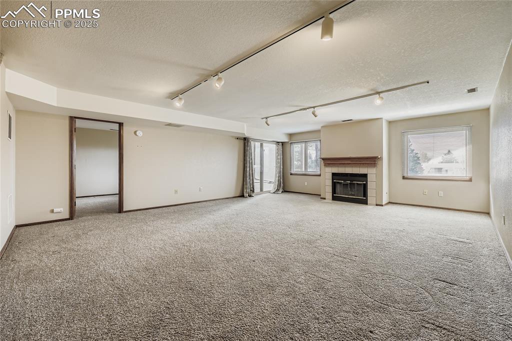 368 Mission Hill Way Colorado Springs, CO 80921 - Photo 24 of 39 a view of empty room with a fireplace