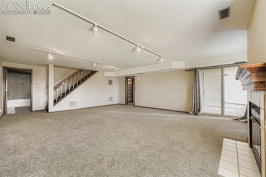 368 Mission Hill Way Colorado Springs, CO 80921 - Photo 26 of 39 a view of an empty room with stairs