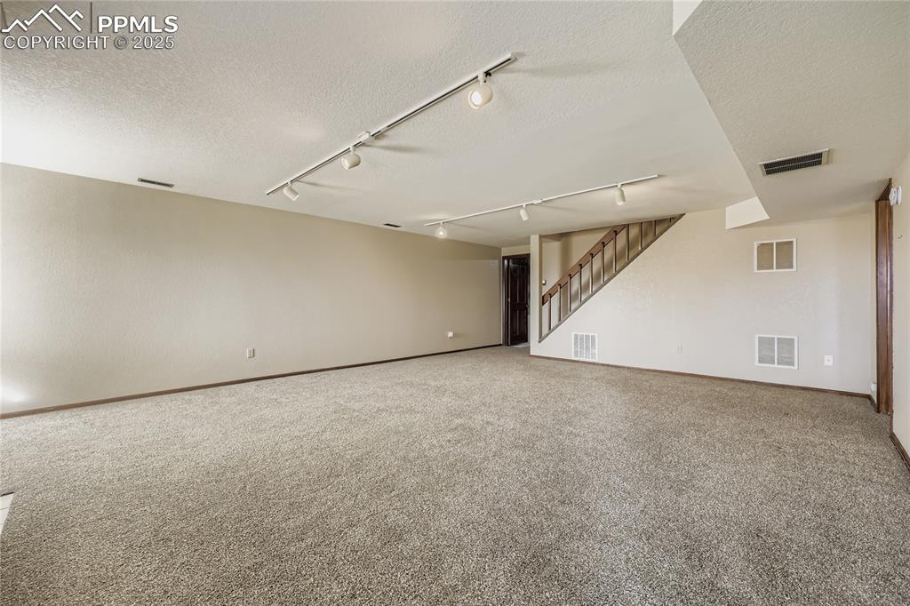 368 Mission Hill Way Colorado Springs, CO 80921 - Photo 27 of 39 a view of an empty room with stairs